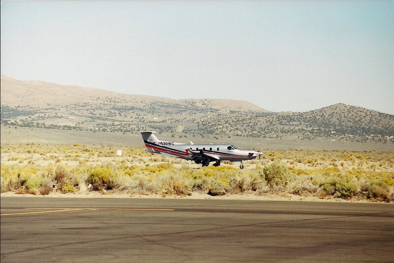 Airplane on Runway — Gray, Desolate