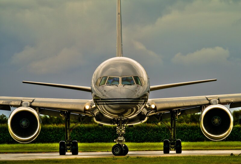Airplane on Runway — Gray, Dramatic, Afternoon