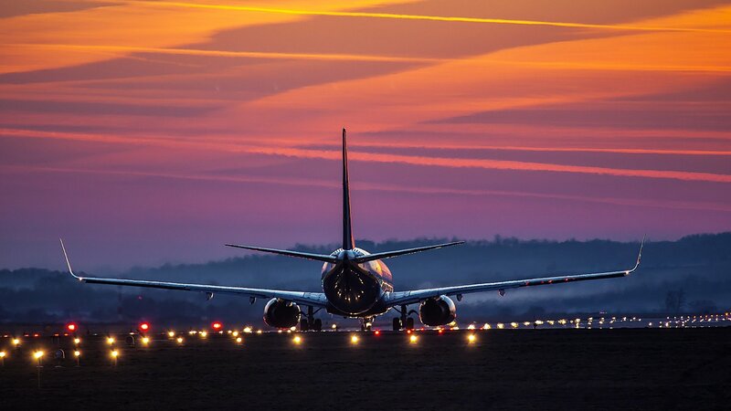 Airplane on Runway — Orange, Dramatic, Sunset, Photograph, Sky, Lights