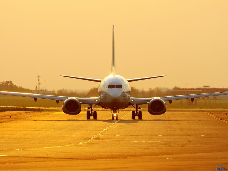 Airplane on Runway — Orange, Serene