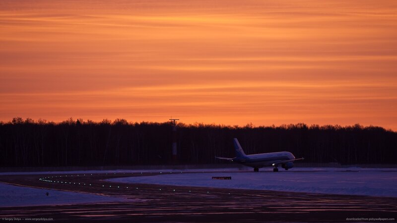 Airplane on Runway — Orange