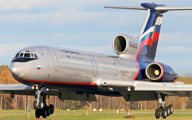 Airplane on Runway — Silver