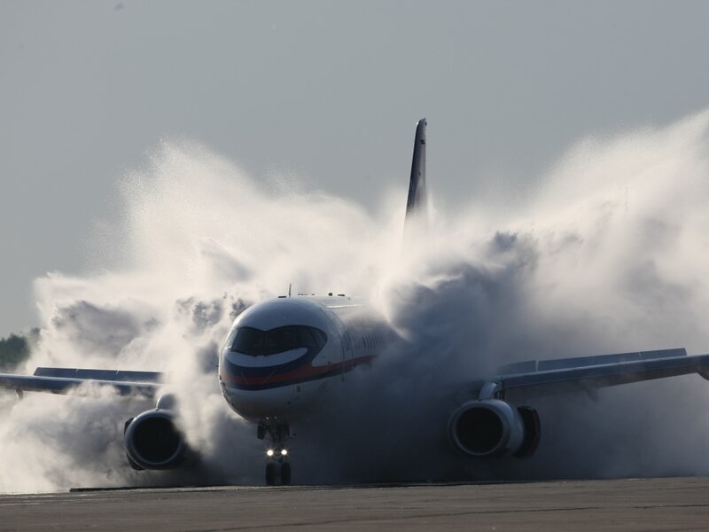Airplane on Runway — White, Dramatic, Afternoon, Photograph