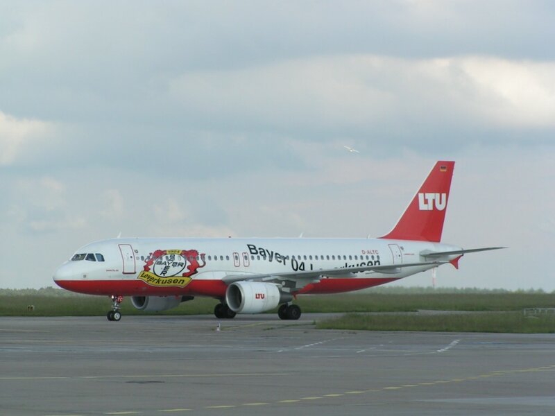 Airplane on Runway — White, Overcast
