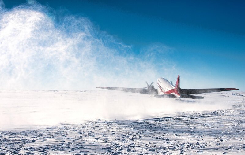 Airplane on Snowy Field — Blue