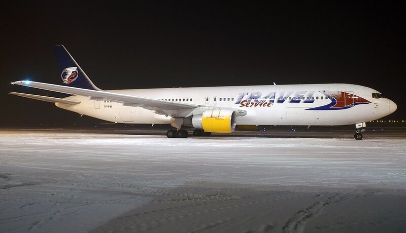 Airplane on Snowy Tarmac — White