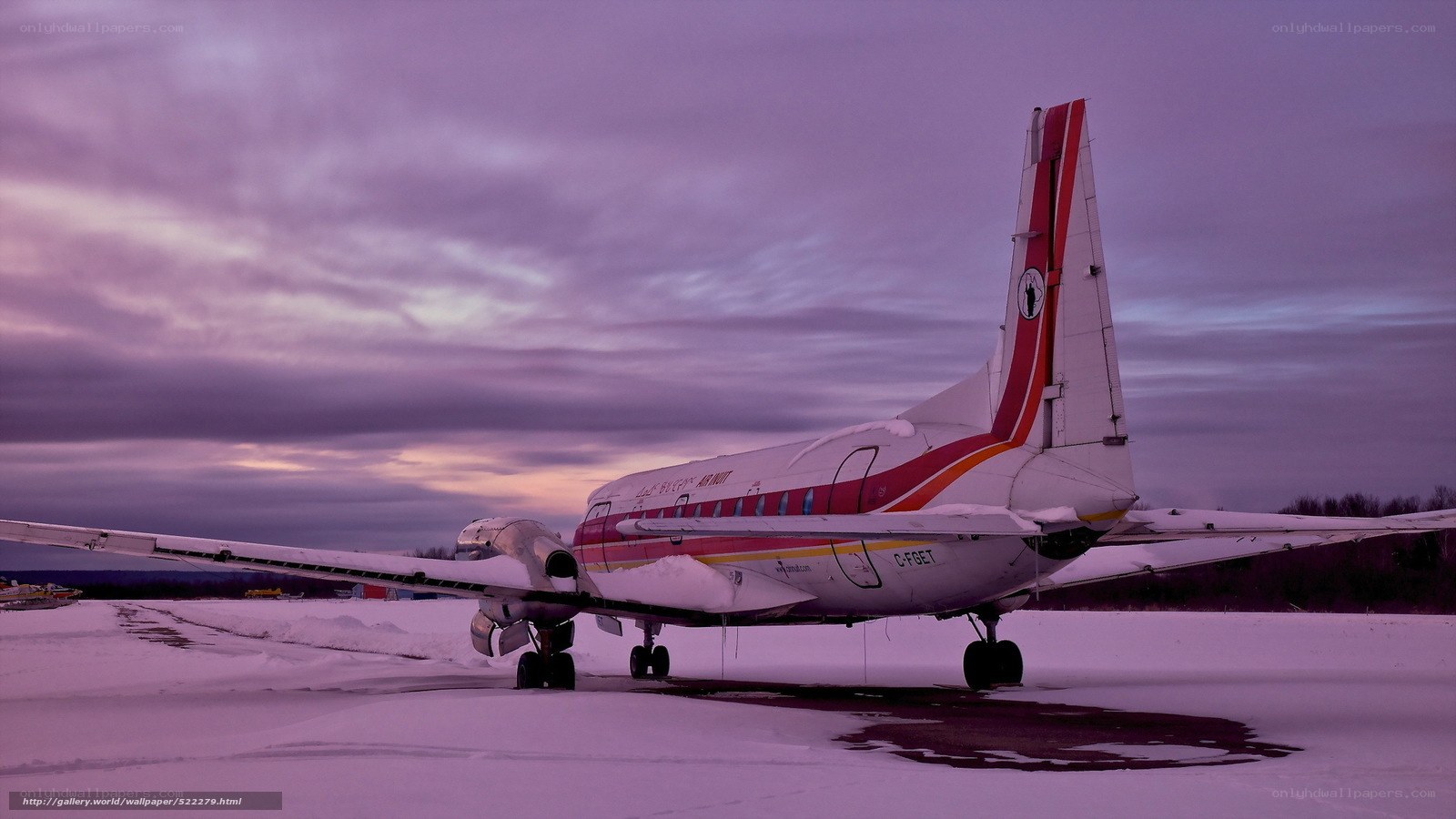 Airplane on snowy tarmac