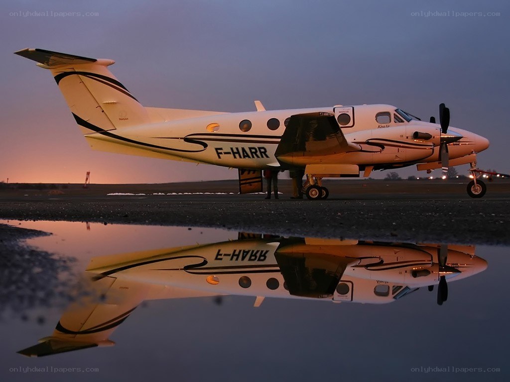 Airplane on tarmac at dusk