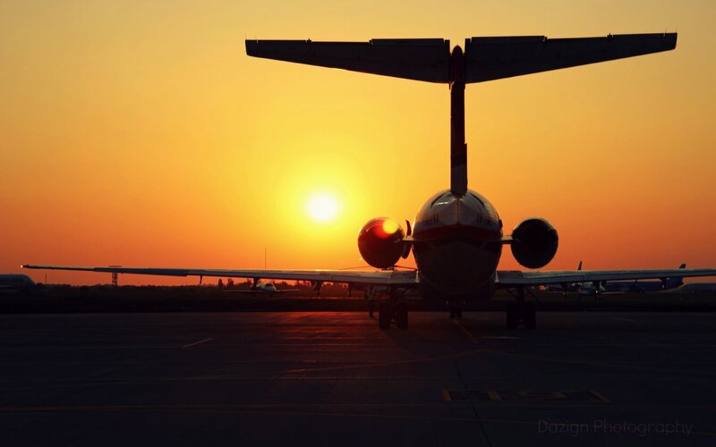 Airplane on Tarmac — Orange, Dramatic