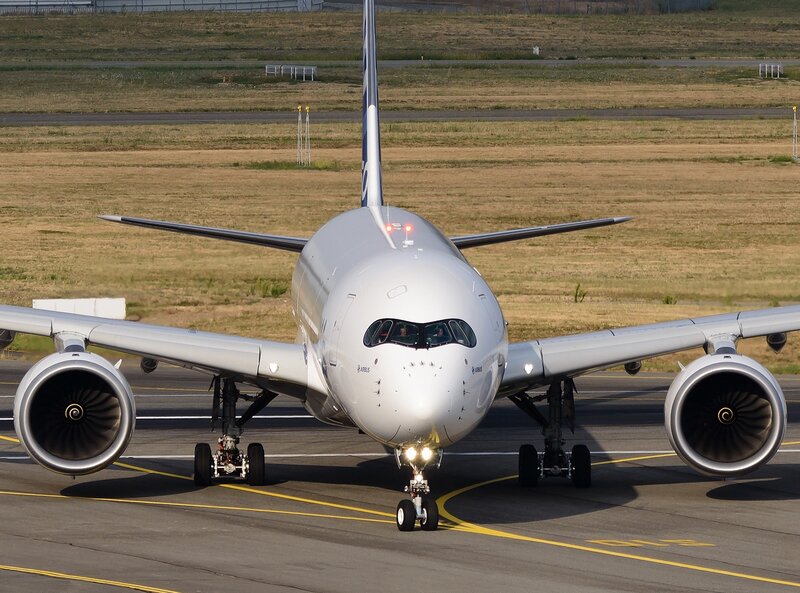 Airplane on Tarmac — White, Calm, Afternoon