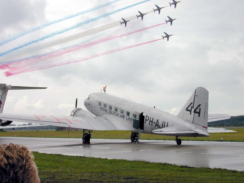 Airplane on tarmac with aerobatic team