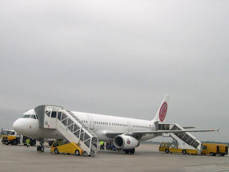 Airplane on tarmac with stairs