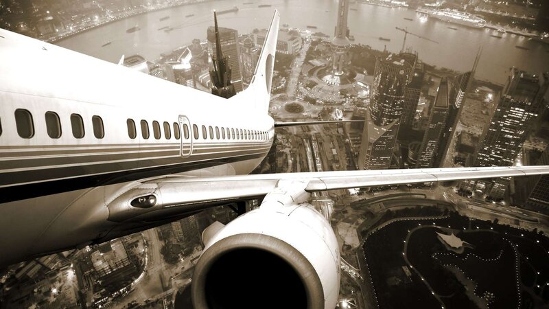 Airplane over City — Black, Dramatic