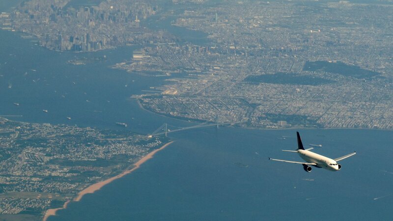 Airplane over City — Blue, Serene