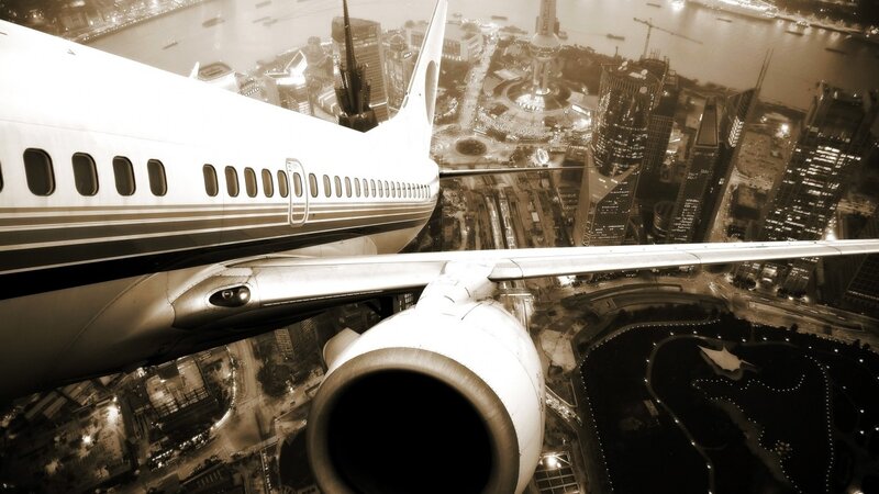 Airplane over City — Sepia