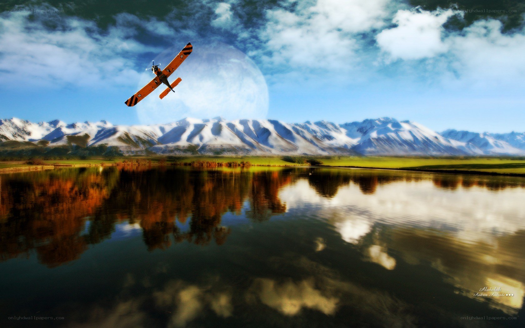 Airplane over mountain lake