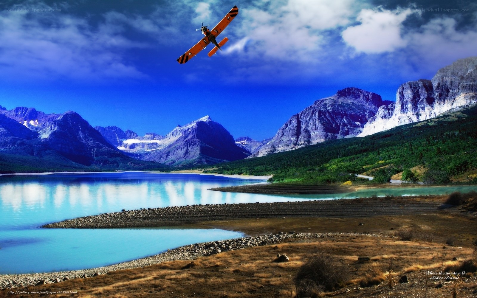 Airplane over mountain lake