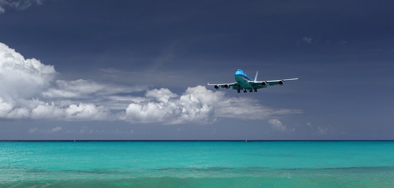 Airplane over Ocean — Blue, Dramatic