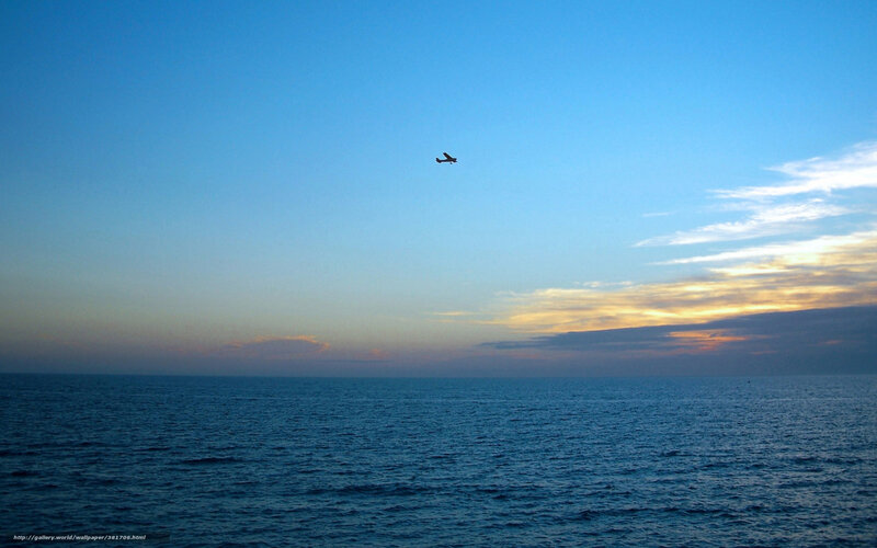 Airplane over Ocean — Blue, Serene, Sunset
