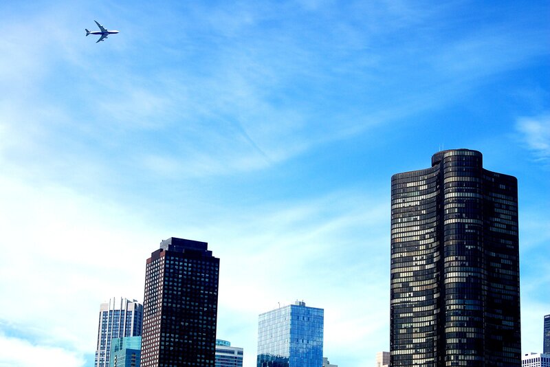 Airplane over Skyscrapers