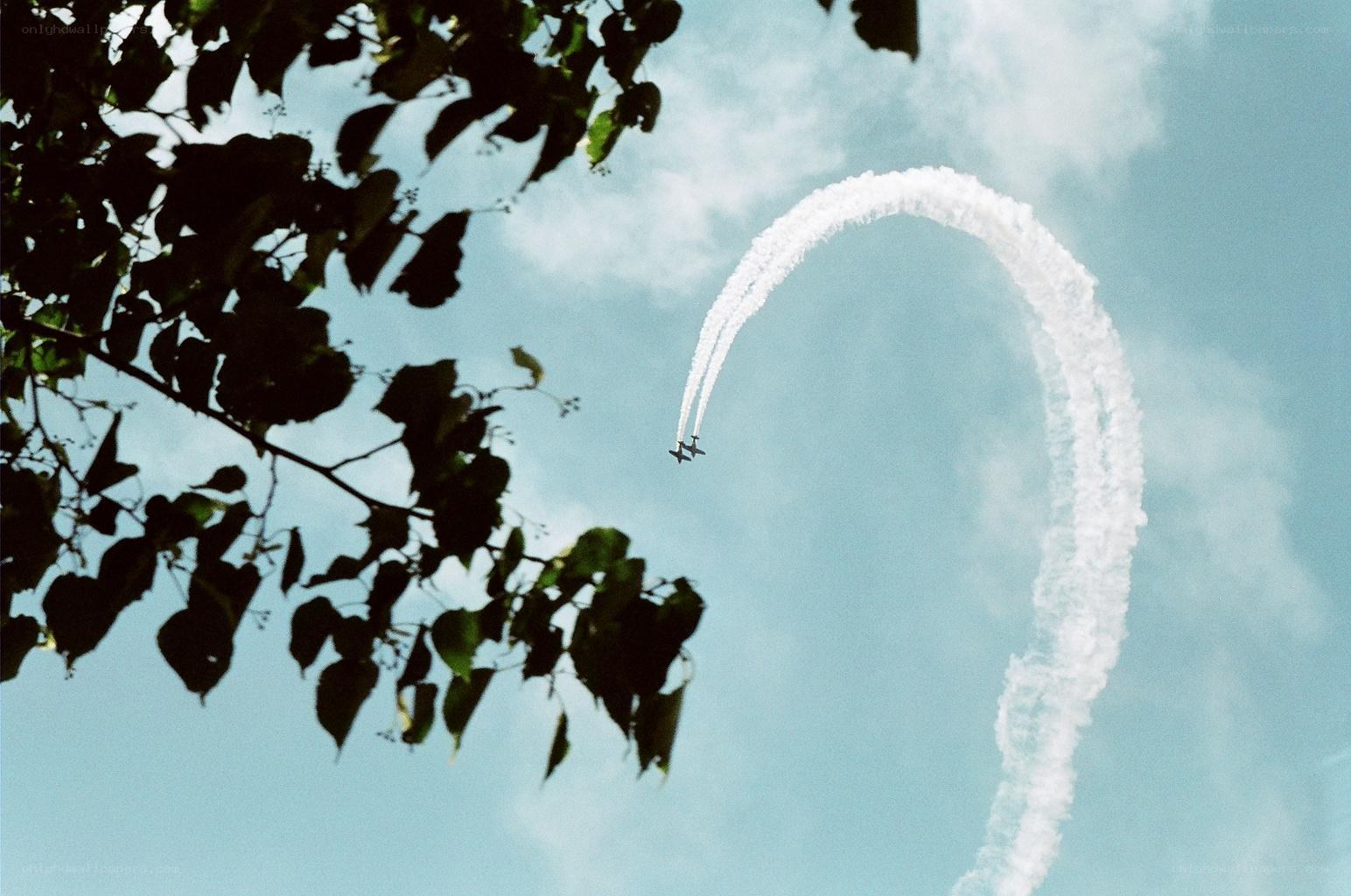 Airplane performing a loop with smoke