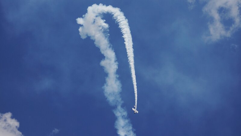 Airplane Performing Aerobatic — Blue, Dynamic, Afternoon, Photograph, Smoke Trail, Clouds