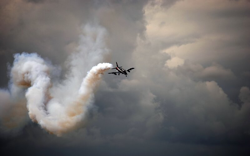 Airplane Performing Aerobatic — Gray, Dramatic, Photograph