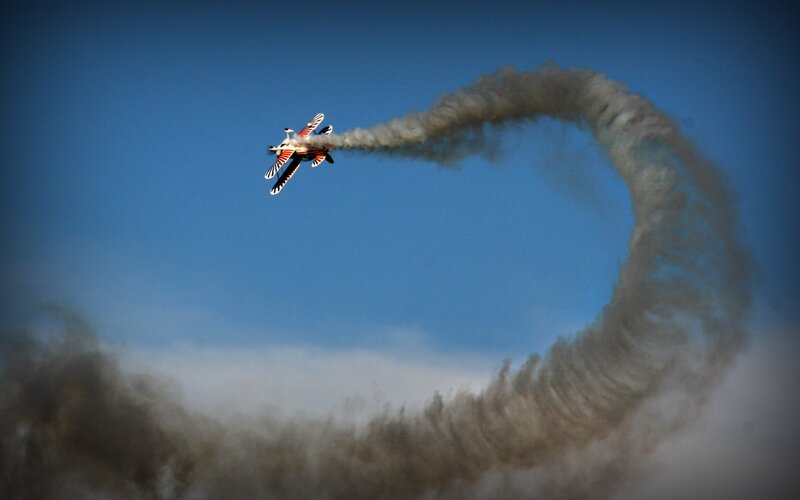 Airplane Performing Aerobatic Loop — Blue