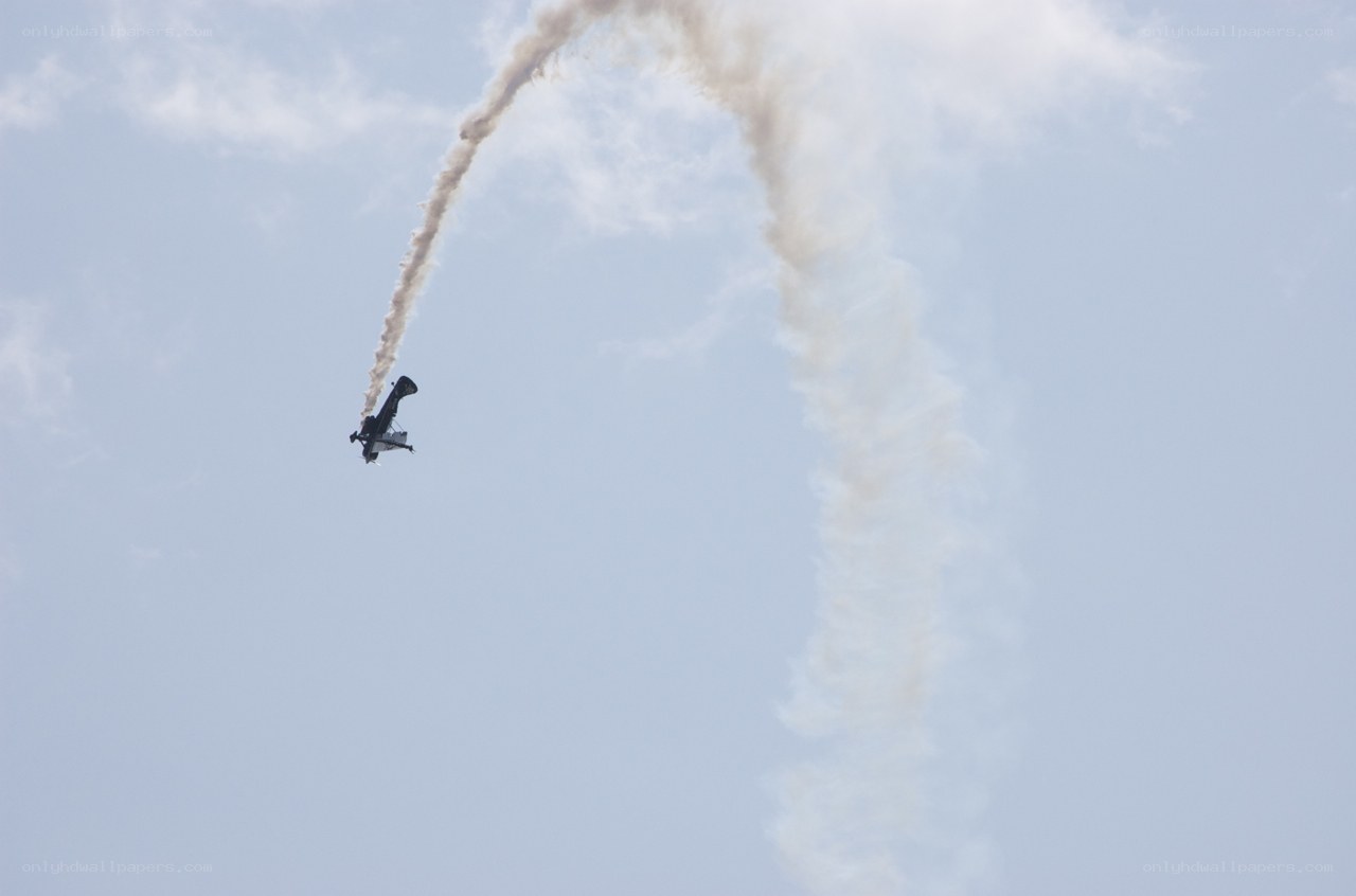 airplane performing aerobatic stunt