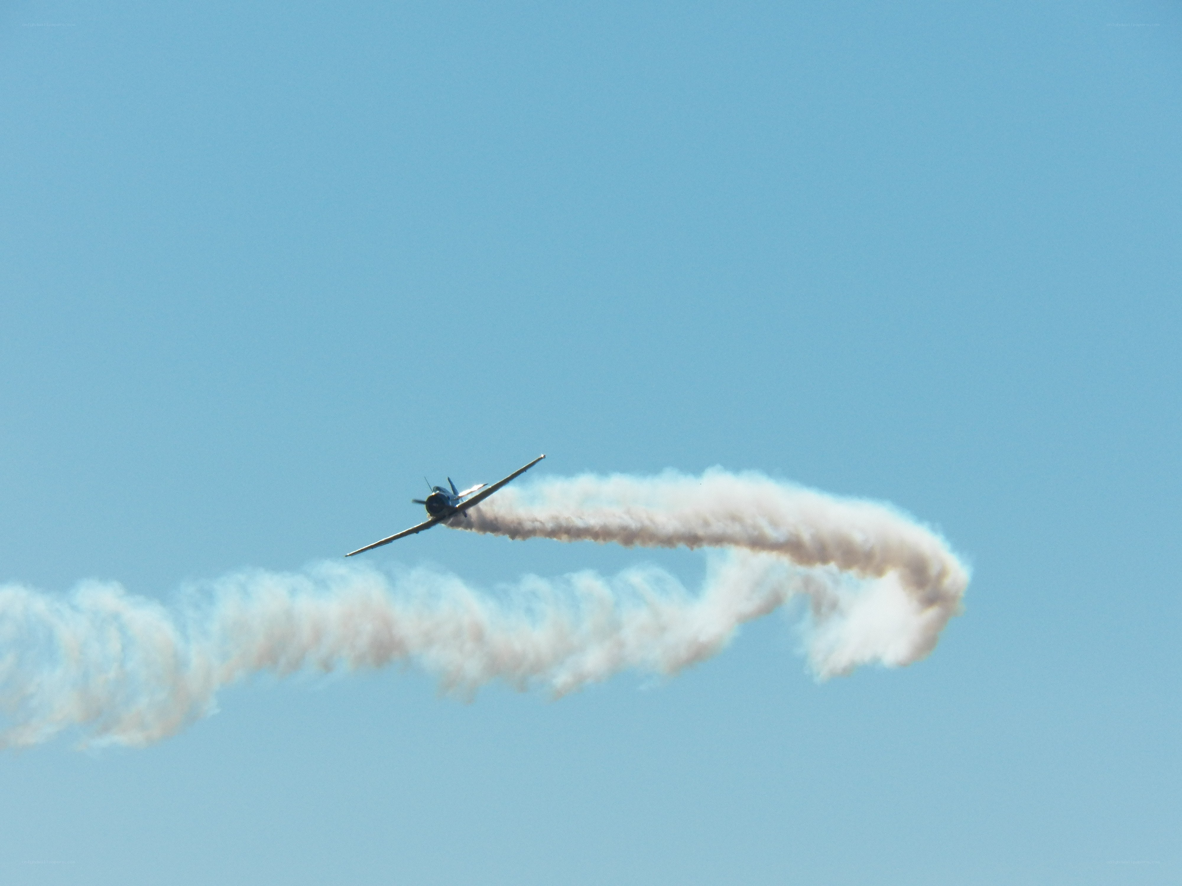 airplane performing aerobatic stunt