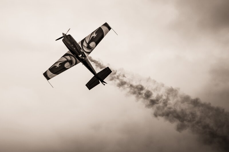 Airplane Performing Aerobatics — Black