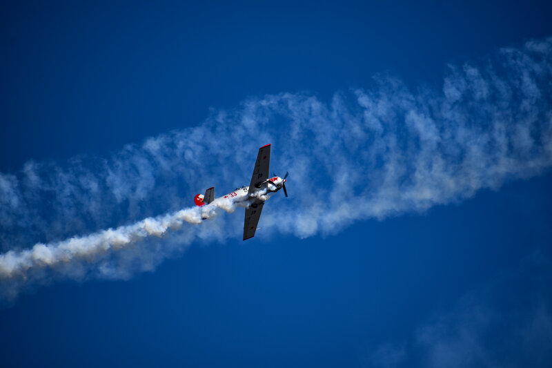 Airplane Performing Aerobatics — Blue, Dramatic