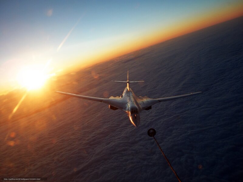 airplane refueling at sunset