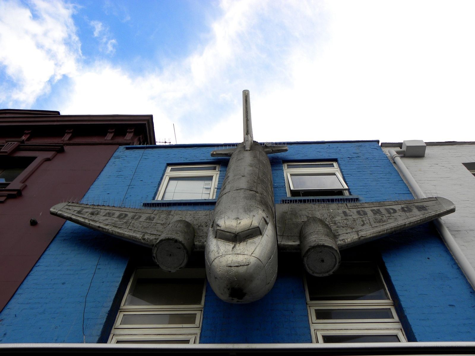 airplane sculpture on building