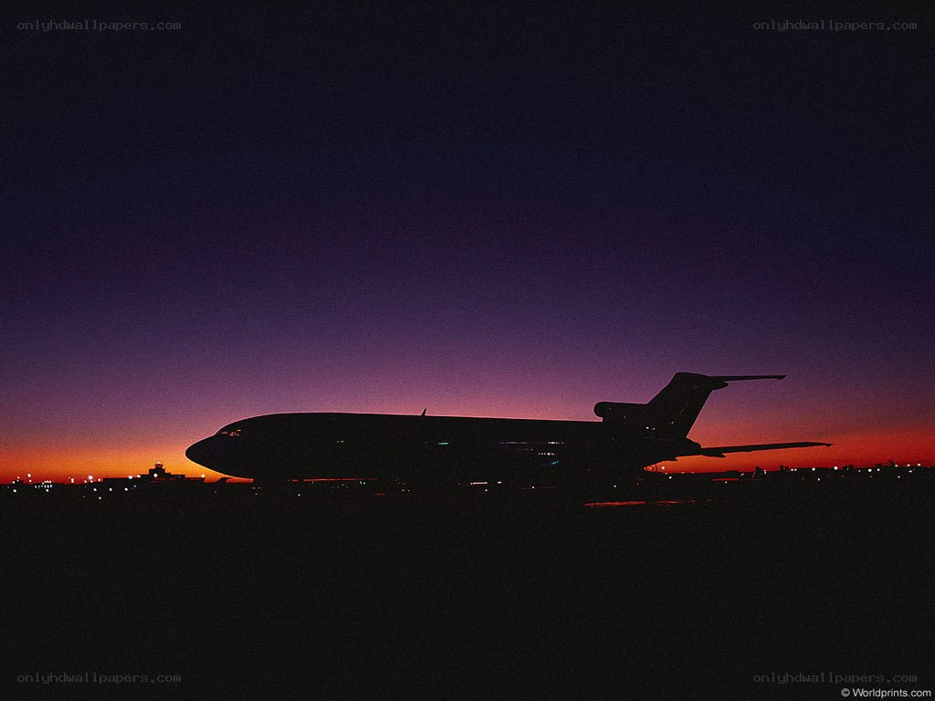 Airplane silhouette at dusk