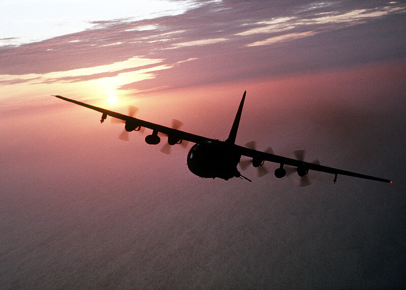 Airplane silhouette at sunset