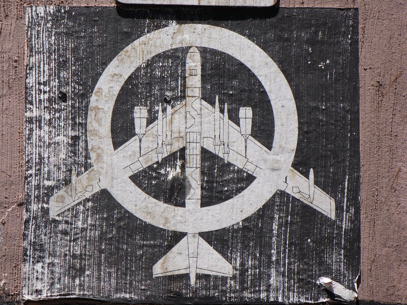 airplane symbol on weathered sign