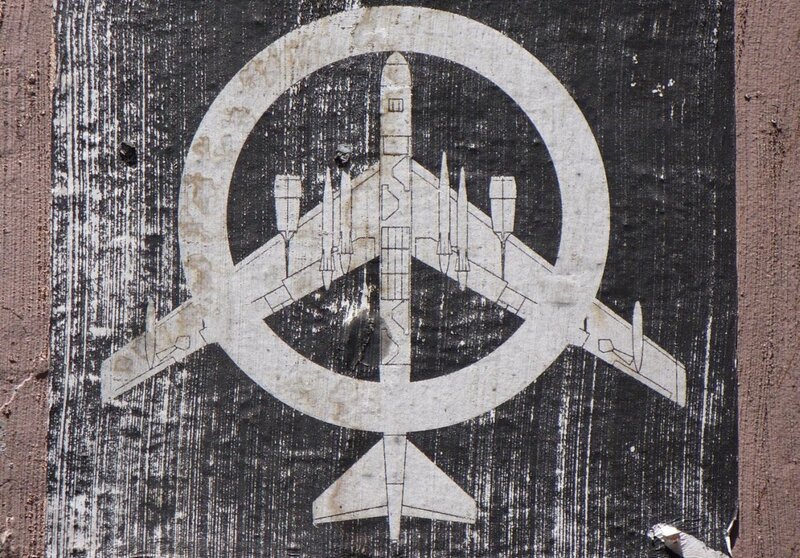 airplane symbol on weathered wood