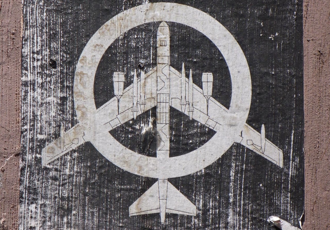 airplane symbol on weathered wood