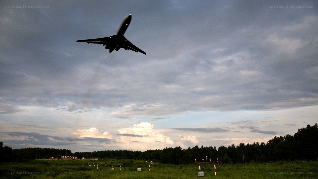 Airplane taking off at dusk
