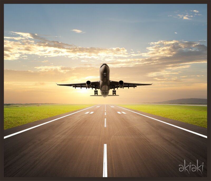 Airplane taking off at sunset