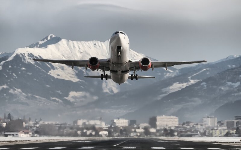 Airplane taking off from mountain airport