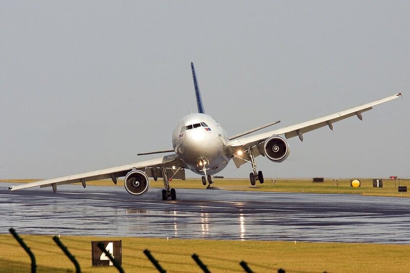 Airplane taking off from wet runway