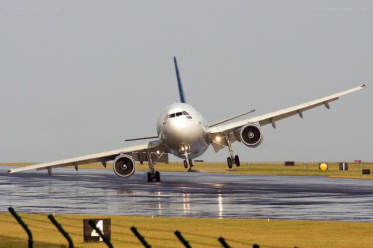 Airplane taking off from wet runway
