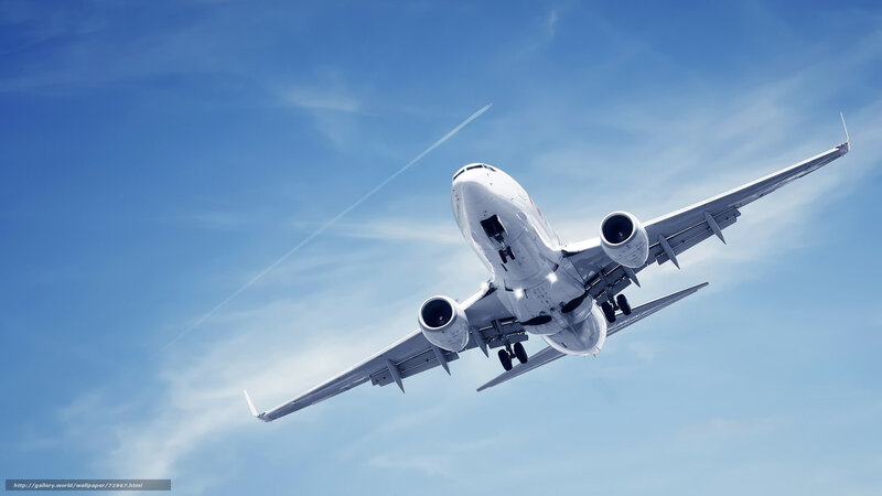 airplane taking off into blue sky