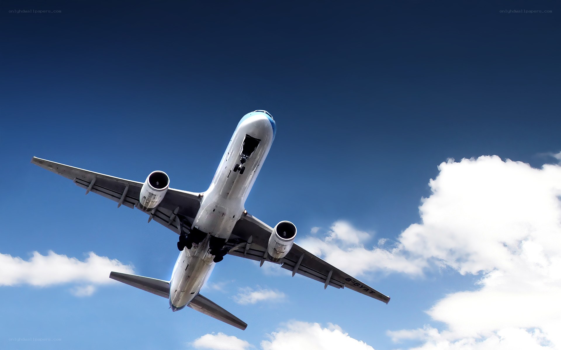 airplane taking off into blue sky