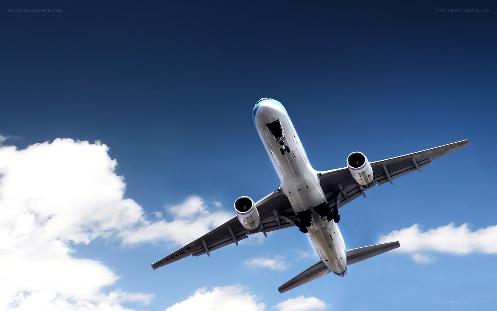 airplane taking off into blue sky