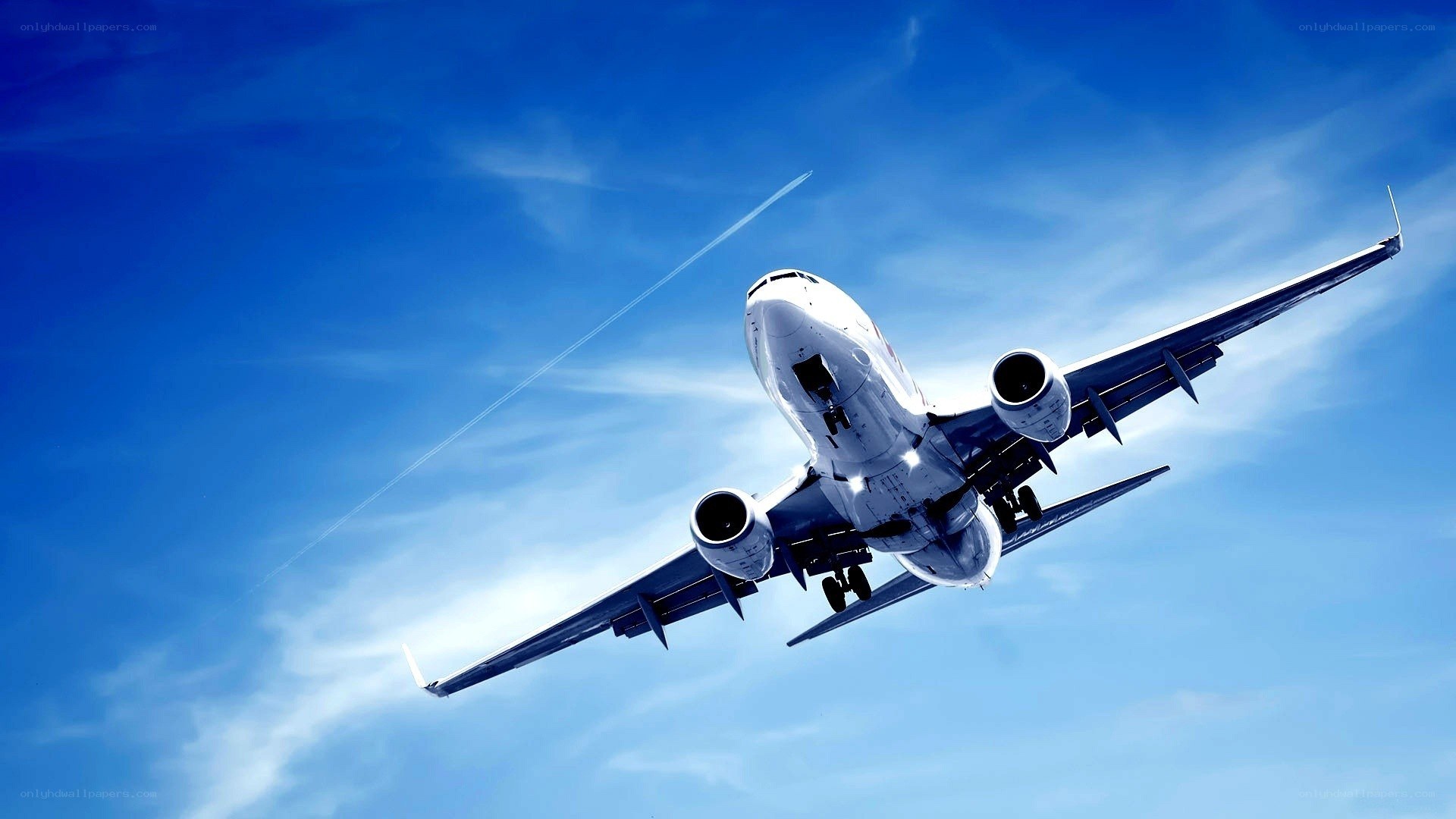 airplane taking off into blue sky