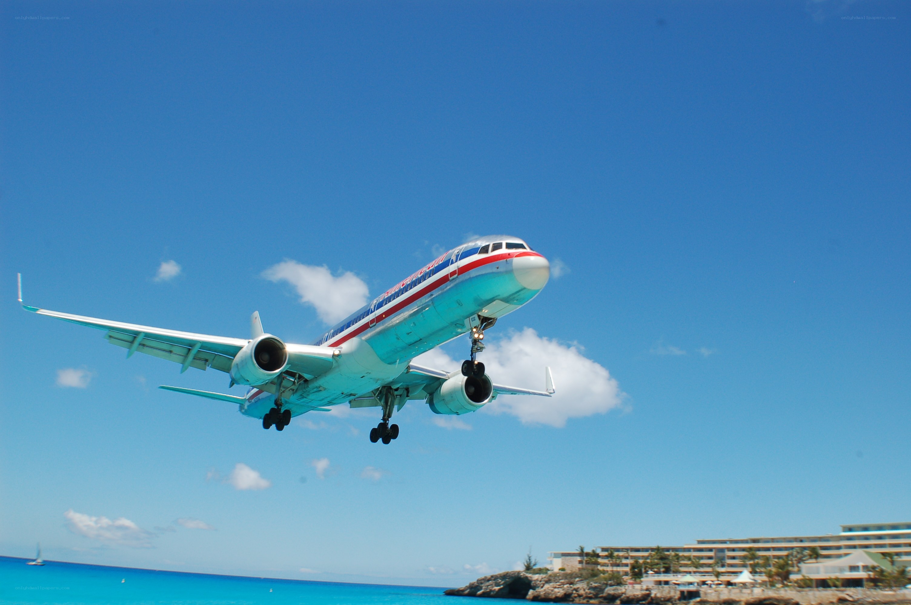 Airplane taking off over ocean