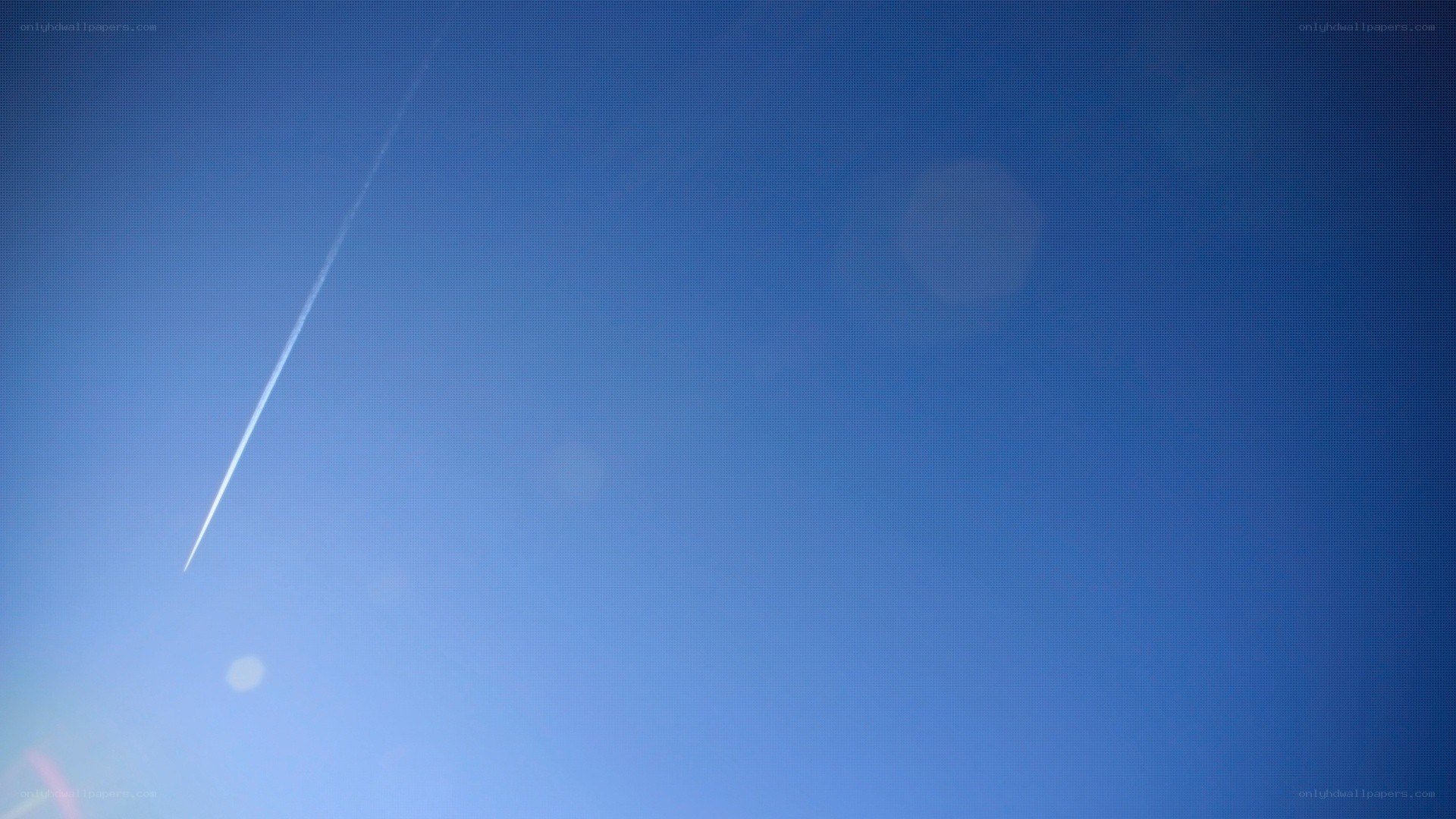 airplane trail in blue sky